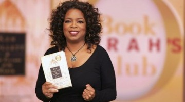 A photo provided by Harpo Productions, Inc., shows talk-show host Oprah Winfrey holding her latest book club selection, Ken Follett's "The Pillars of the Earth," during taping of the "The Oprah Winfrey Show" on Wednesday, Nov. 14, 2007, in Chicago. (AP Photo/Harpo Productions, Inc., George Burns) ** NO SALES